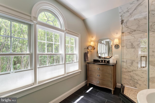 5026 Huntwood Manor Dr, Fairfax, VA 22030 - full bathroom with vanity, a marble finish shower, tile patterned floors, vaulted ceiling, and baseboards