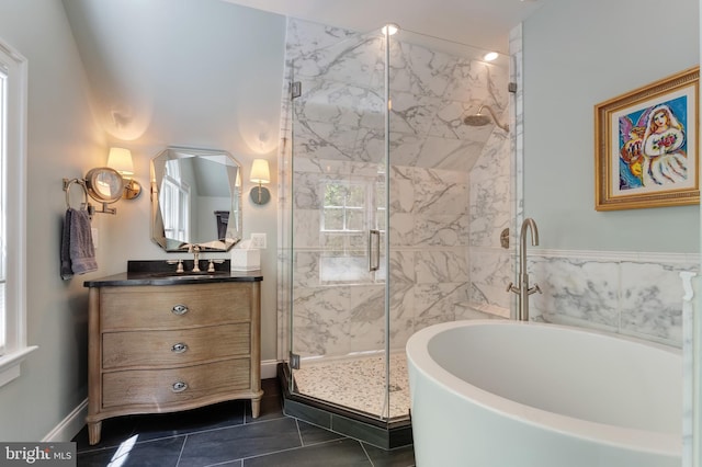 5026 Huntwood Manor Dr, Fairfax, VA 22030 - bathroom with a tub to relax in, a marble finish shower, vanity, tile patterned floors, and baseboards