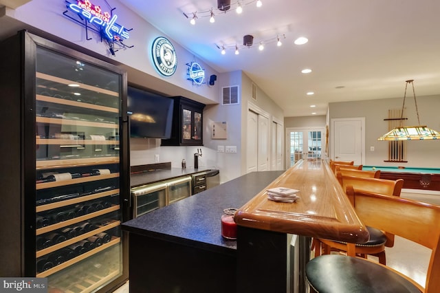 5026 Huntwood Manor Dr, Fairfax, VA 22030 - indoor wet bar featuring recessed lighting, wine cooler, decorative light fixtures, and pool table
