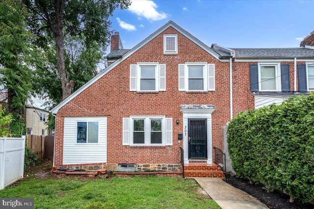 307 W 32nd St, Wilmington, DE 19802 - view of front facade with a chimney and brick siding
