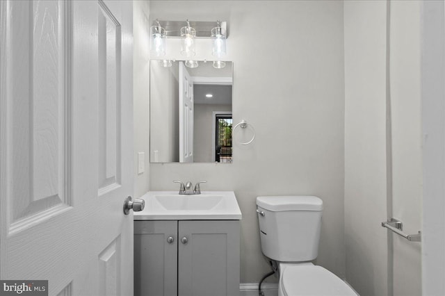 307 W 32nd St, Wilmington, DE 19802 - half bathroom featuring toilet and vanity