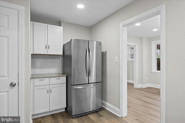 307 W 32nd St, Wilmington, DE 19802 - kitchen with freestanding refrigerator, white cabinetry, baseboards, wood finished floors, and recessed lighting