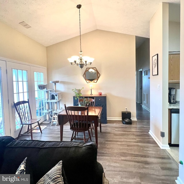 2125 Wainwright Ct Unit 2C, Frederick, MD 21702 - dining room featuring a chandelier, wood finished floors, lofted ceiling, and a textured ceiling