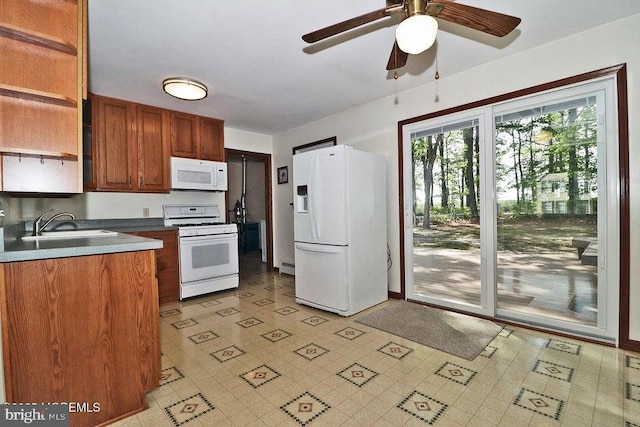 50 Nautilus Dr, Barnegat, NJ 08005 - kitchen with white appliances, a sink, a ceiling fan, open shelves, and brown cabinets