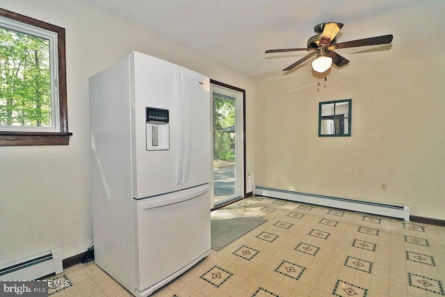 50 Nautilus Dr, Barnegat, NJ 08005 - kitchen with white fridge with ice dispenser, a baseboard radiator, a ceiling fan, and baseboards