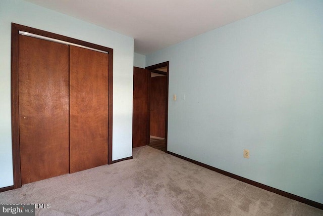 50 Nautilus Dr, Barnegat, NJ 08005 - unfurnished bedroom with light colored carpet, a closet, and baseboards
