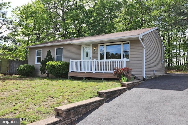 50 Nautilus Dr, Barnegat, NJ 08005 - view of front facade featuring covered porch and a front lawn