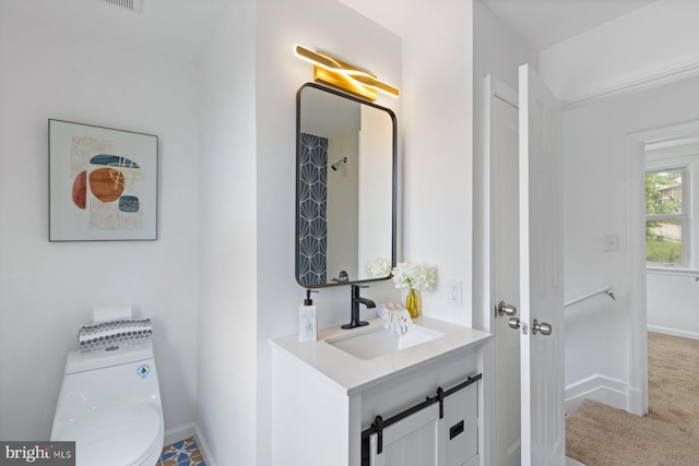 2318 Cloville Ave, Baltimore, MD 21214 - bathroom featuring baseboards, vanity, and toilet