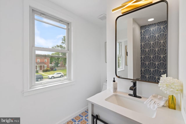 2318 Cloville Ave, Baltimore, MD 21214 - bathroom featuring vanity, baseboards, and tile patterned floors