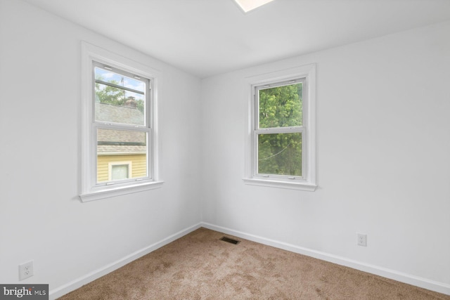 2318 Cloville Ave, Baltimore, MD 21214 - carpeted spare room featuring healthy amount of natural light and baseboards