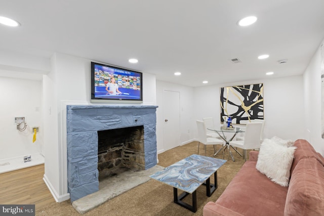 2318 Cloville Ave, Baltimore, MD 21214 - living room featuring recessed lighting, a fireplace, baseboards, and carpet floors