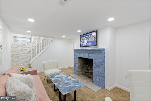 2318 Cloville Ave, Baltimore, MD 21214 - living room featuring carpet flooring, a tiled fireplace, baseboards, stairs, and recessed lighting