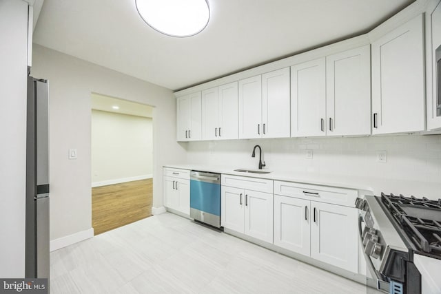 2831 Goucher Ave, Delanco, NJ 08075 - kitchen with appliances with stainless steel finishes, a sink, light countertops, and white cabinetry