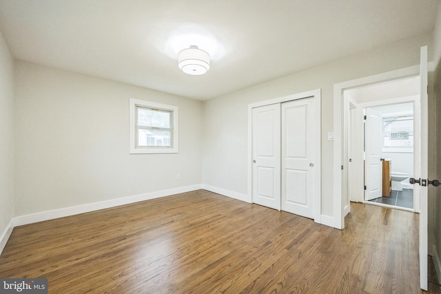 2831 Goucher Ave, Delanco, NJ 08075 - unfurnished bedroom featuring multiple windows, wood finished floors, and a closet