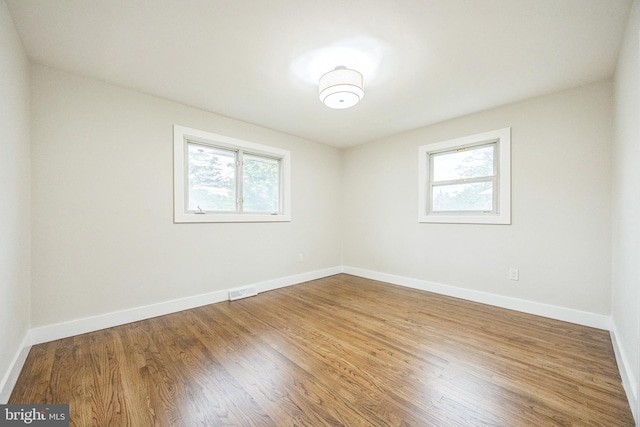 2831 Goucher Ave, Delanco, NJ 08075 - spare room featuring plenty of natural light, wood finished floors, and baseboards
