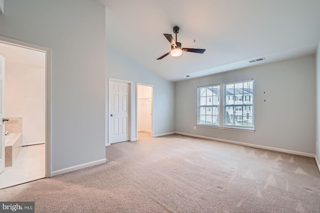 4827 Atlas Cedar Way, Aberdeen, MD 21001 - unfurnished bedroom with carpet flooring, baseboards, a spacious closet, vaulted ceiling, and a closet