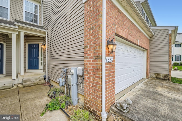 4827 Atlas Cedar Way, Aberdeen, MD 21001 - doorway to property with driveway, brick siding, and a garage