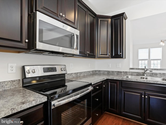 100 Norwood Dr, Falling Waters, WV 25419 - kitchen with appliances with stainless steel finishes, a sink, and dark wood-type flooring
