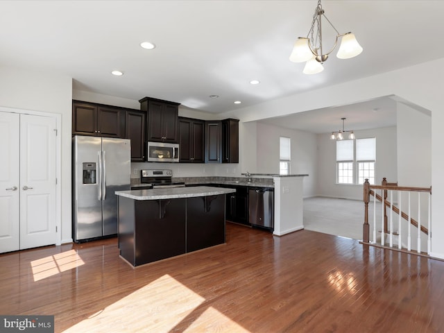 100 Norwood Dr, Falling Waters, WV 25419 - kitchen with stainless steel appliances, a chandelier, a center island, dark wood-style floors, and recessed lighting