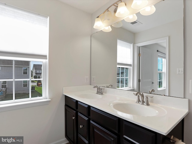 100 Norwood Dr, Falling Waters, WV 25419 - bathroom with a chandelier and double vanity