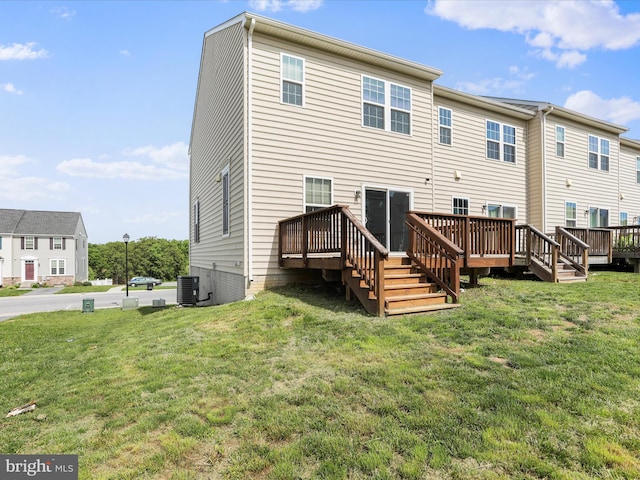 100 Norwood Dr, Falling Waters, WV 25419 - rear view of property featuring central air condition unit, a wooden deck, and a lawn