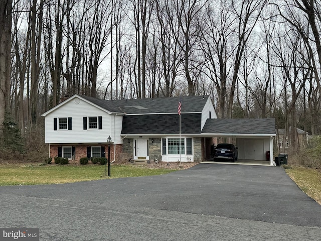 2042 Carrhill Rd, Vienna, VA 22181 - view of front of house with a front lawn, asphalt driveway, a carport, and roof with shingles