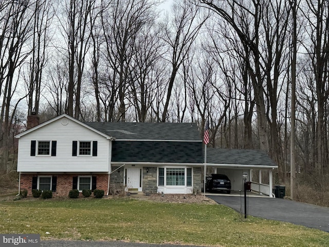 2042 Carrhill Rd, Vienna, VA 22181 - split level home with asphalt driveway, an attached carport, a front yard, a chimney, and a shingled roof