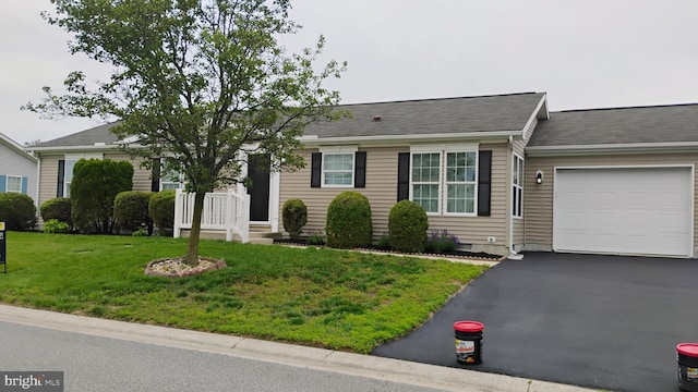 710 Mcginnis Dr Unit 710, Dover, DE 19901 - ranch-style house featuring an attached garage, a front lawn, and asphalt driveway