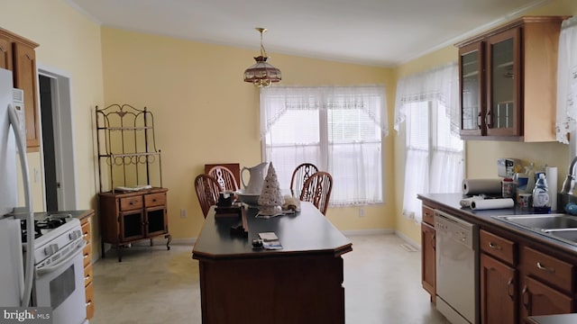 710 Mcginnis Dr Unit 710, Dover, DE 19901 - kitchen featuring white appliances, healthy amount of natural light, glass insert cabinets, dark countertops, and vaulted ceiling