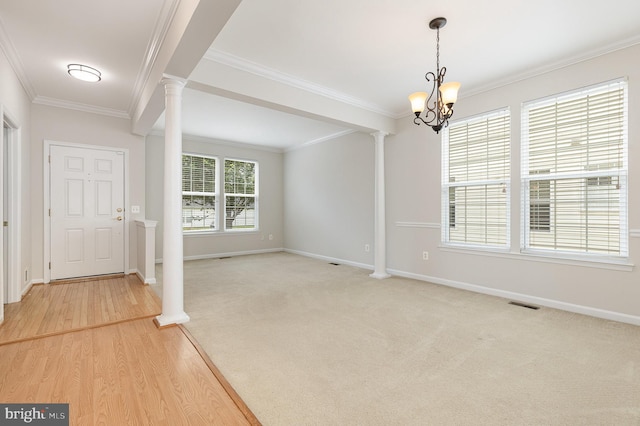 3839 Mulberry Point Ct, Dumfries, VA 22025 - foyer featuring decorative columns, ornamental molding, baseboards, a chandelier, and light wood-type flooring