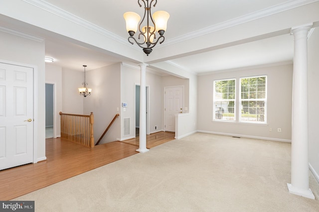 3839 Mulberry Point Ct, Dumfries, VA 22025 - empty room featuring a chandelier, carpet, ornate columns, ornamental molding, and baseboards