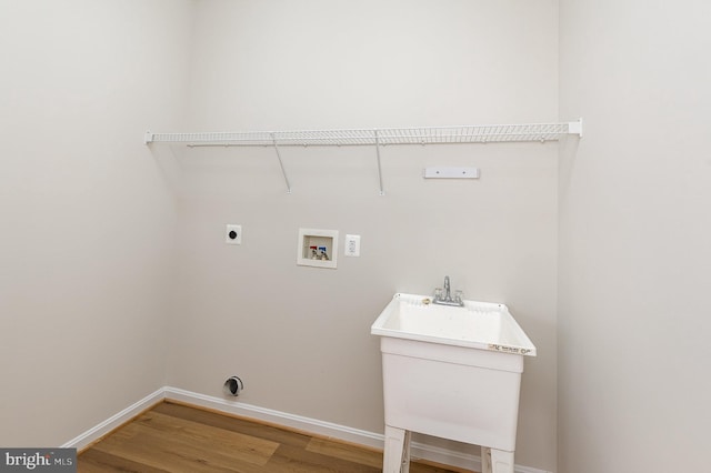 3839 Mulberry Point Ct, Dumfries, VA 22025 - laundry area featuring hookup for an electric dryer, light wood-type flooring, washer hookup, and baseboards