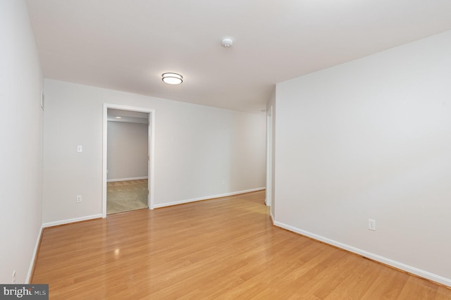 3839 Mulberry Point Ct, Dumfries, VA 22025 - empty room with light wood-style floors, a smoke detector, and baseboards