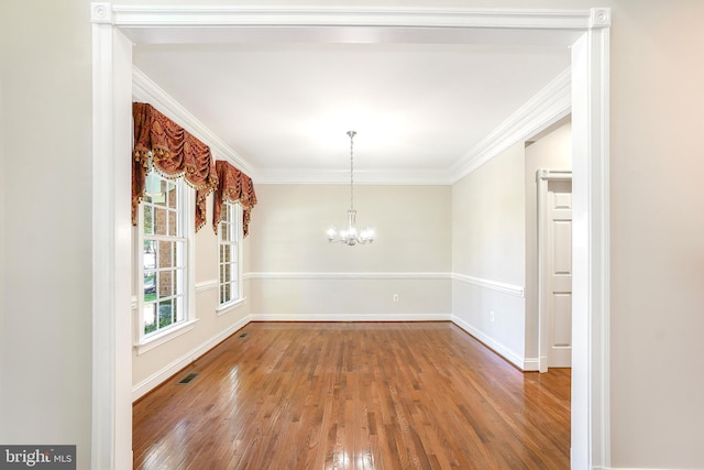 3530 Schuerman House Dr, Fairfax, VA 22031 - unfurnished dining area with wood finished floors, a chandelier, baseboards, and crown molding