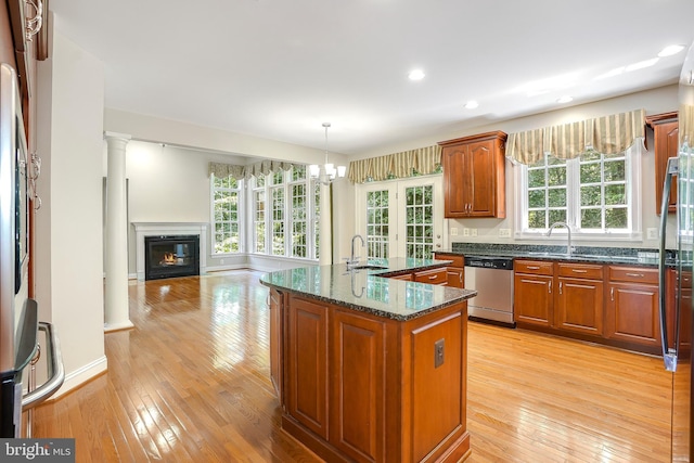 3530 Schuerman House Dr, Fairfax, VA 22031 - kitchen featuring stainless steel dishwasher, light wood-style floors, a sink, dark stone countertops, and recessed lighting