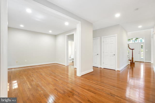 3530 Schuerman House Dr, Fairfax, VA 22031 - unfurnished living room with light wood-type flooring, stairway, baseboards, and recessed lighting