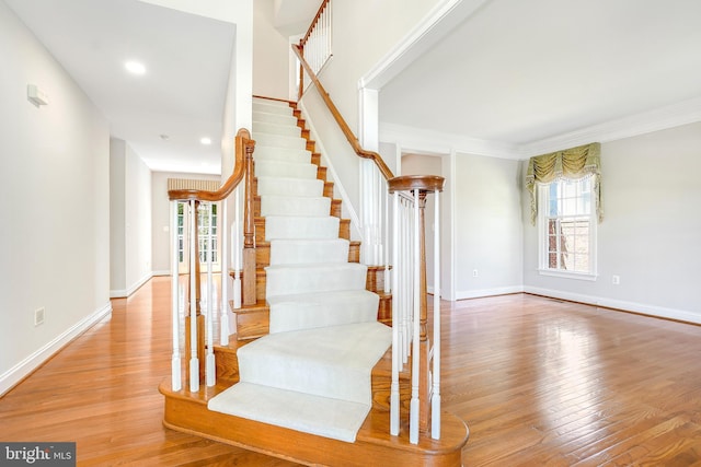3530 Schuerman House Dr, Fairfax, VA 22031 - stairs with healthy amount of natural light, wood finished floors, crown molding, baseboards, and recessed lighting