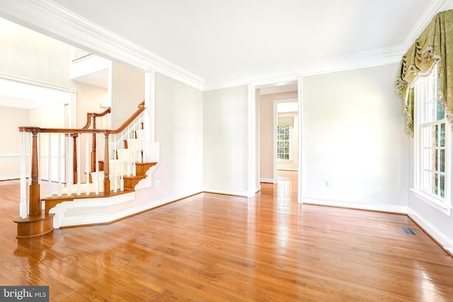 3530 Schuerman House Dr, Fairfax, VA 22031 - empty room with healthy amount of natural light, wood finished floors, crown molding, and stairway