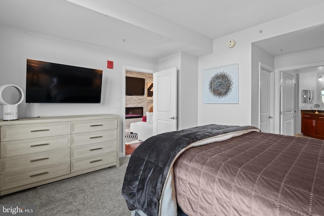 155 Potomac Psge Unit 809, Oxon Hill, MD 20745 - carpeted bedroom with a glass covered fireplace and ensuite bath