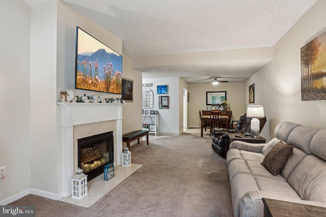700 Avondale Rd Unit Ph-12, Wallingford, PA 19086 - carpeted living area featuring ceiling fan, a fireplace with flush hearth, a textured ceiling, and baseboards