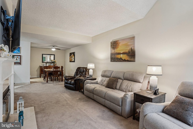 700 Avondale Rd Unit Ph-12, Wallingford, PA 19086 - living area with light colored carpet, a premium fireplace, a textured ceiling, and ceiling fan