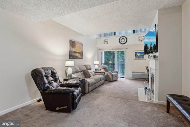 700 Avondale Rd Unit Ph-12, Wallingford, PA 19086 - carpeted living room with a textured ceiling, a fireplace, and baseboards