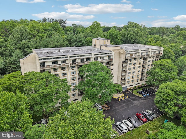 700 Avondale Rd Unit Ph-12, Wallingford, PA 19086 - view of apartment building / complex featuring uncovered parking and a wooded view