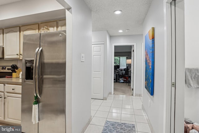 700 Avondale Rd Unit Ph-12, Wallingford, PA 19086 - kitchen with stainless steel appliances, a textured ceiling, baseboards, light tile patterned flooring, and recessed lighting