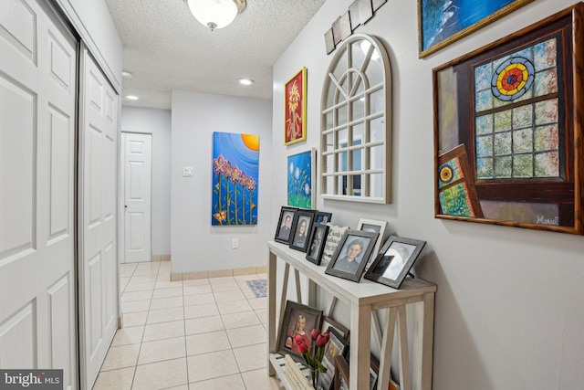 700 Avondale Rd Unit Ph-12, Wallingford, PA 19086 - hall featuring tile patterned flooring, a textured ceiling, recessed lighting, and baseboards