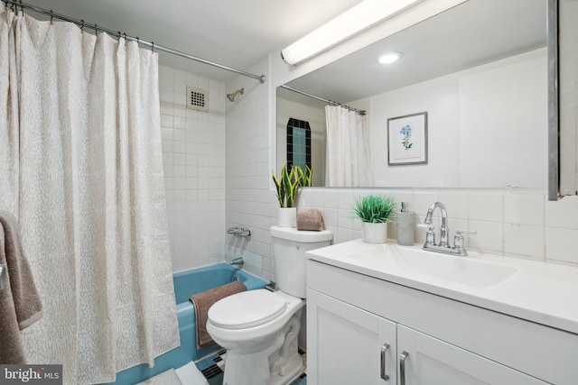 700 7th St SW Unit 512, Washington, DC 20024 - bathroom with vanity, shower / tub combo with curtain, toilet, and backsplash