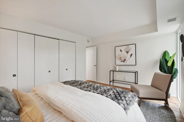 700 7th St SW Unit 512, Washington, DC 20024 - bedroom featuring wood finished floors, a closet, and baseboards