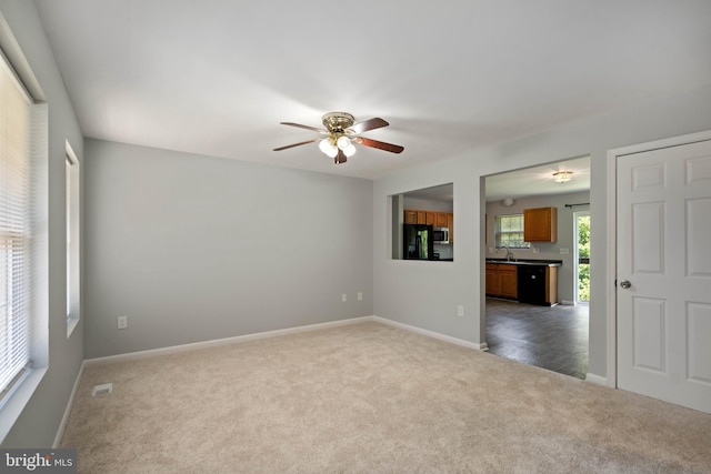 430 Cedar Creek Dr, Harpers Ferry, WV 25425 - spare room with dark colored carpet, a ceiling fan, baseboards, and a sink