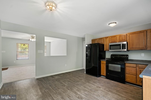 430 Cedar Creek Dr, Harpers Ferry, WV 25425 - kitchen with black appliances, dark wood-style flooring, open floor plan, and brown cabinets