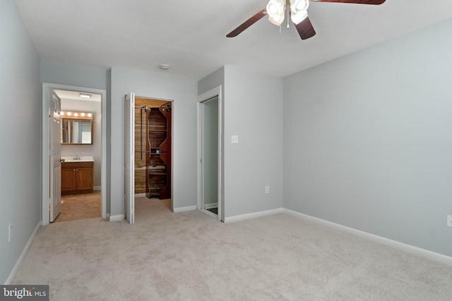 430 Cedar Creek Dr, Harpers Ferry, WV 25425 - unfurnished bedroom featuring light carpet, baseboards, a closet, a sink, and connected bathroom